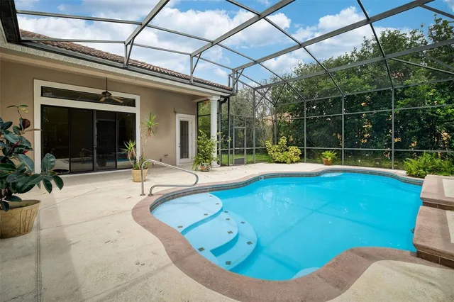 a view of a swimming pool with a patio