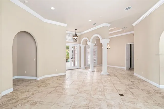 a view of a livingroom with wooden floor and entryway