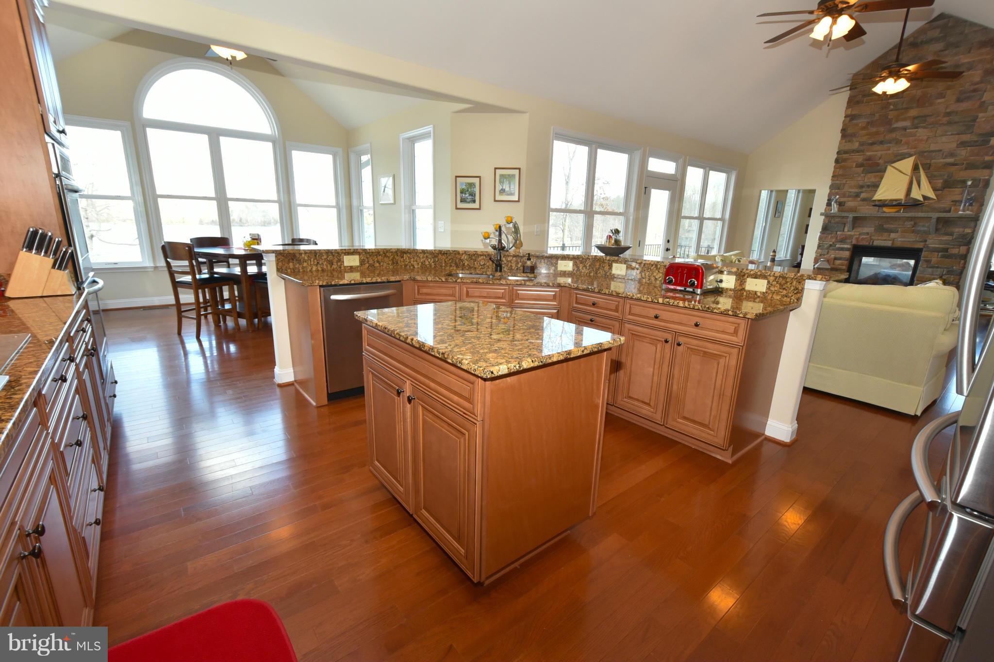 264 Lane Road Bumpass, VA 23024 - Photo 11 of 30 a large kitchen with lots of counter space a sink and a large window