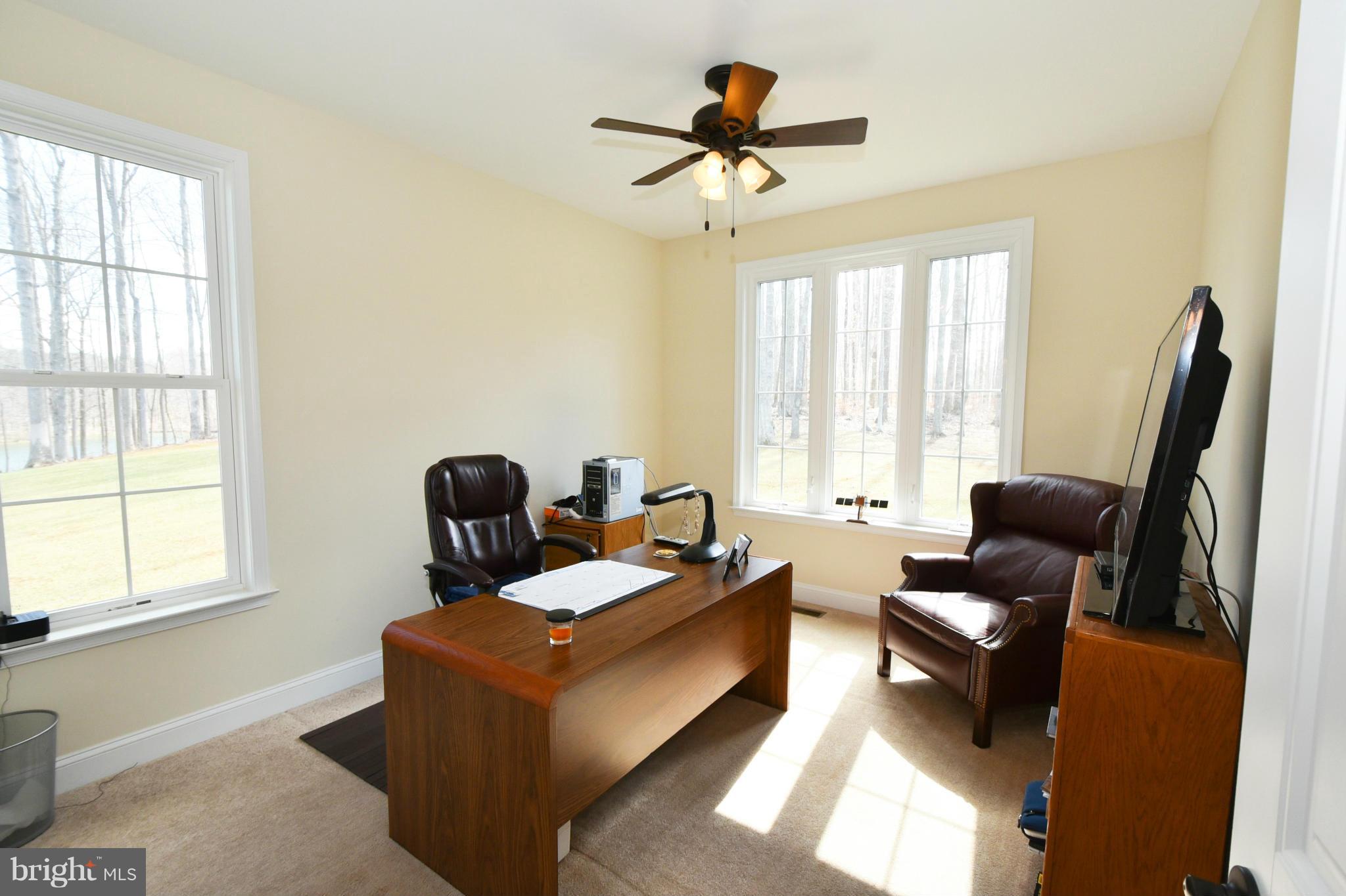 264 Lane Road Bumpass, VA 23024 - Photo 19 of 30 a living room with furniture and a window