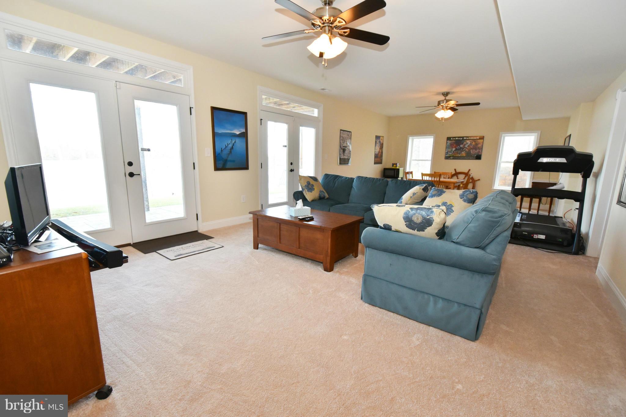 264 Lane Road Bumpass, VA 23024 - Photo 21 of 30 a living room with furniture and a flat screen tv