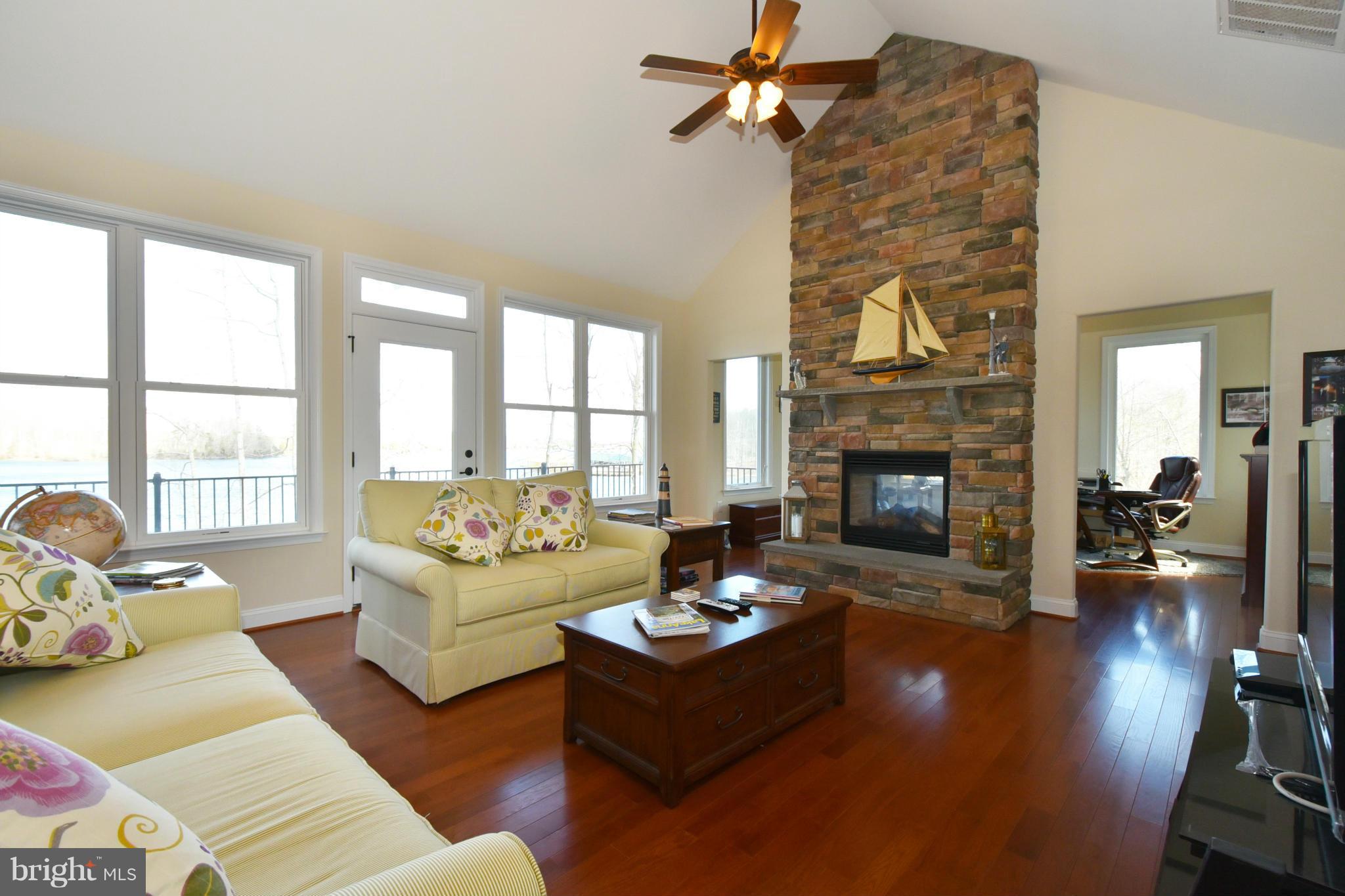 264 Lane Road Bumpass, VA 23024 - Photo 5 of 30 a living room with furniture and a fireplace