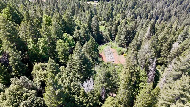 a view of a backyard with sitting area