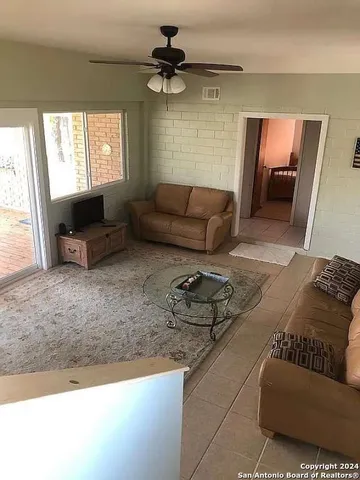 a living room with furniture and a rug
