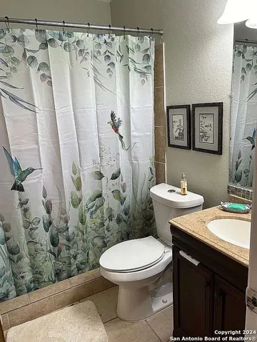 a bathroom with a double vanity sink and mirror