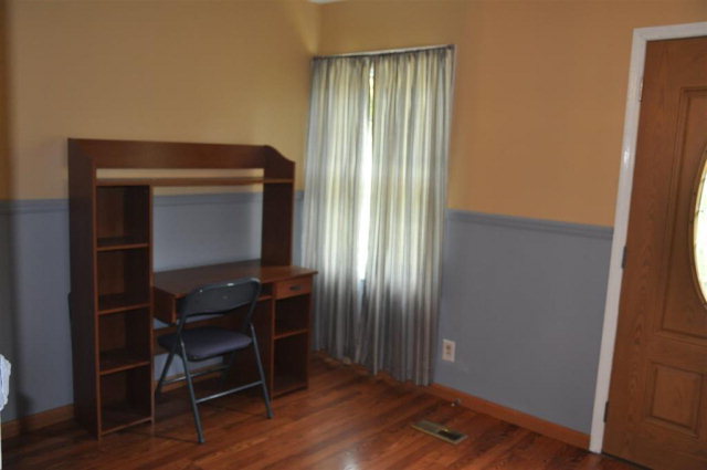 202 Delone Road Byron, GA 31008 - Photo 16 of 20 a room with a door and wooden floor