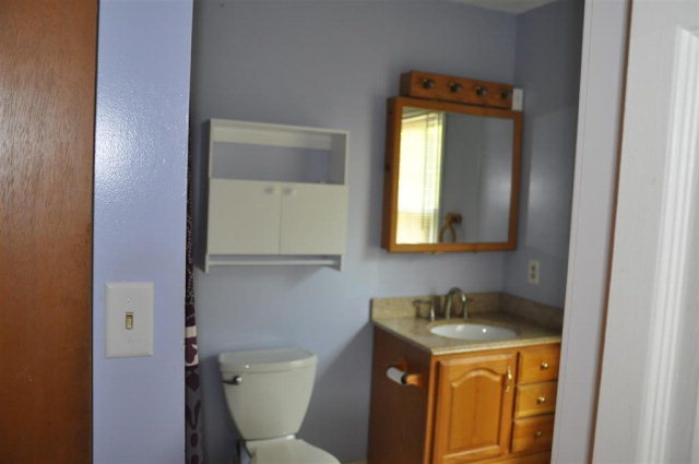 202 Delone Road Byron, GA 31008 - Photo 18 of 20 a bathroom with a toilet sink and mirror