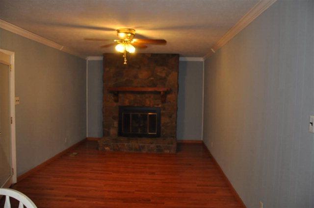202 Delone Road Byron, GA 31008 - Photo 20 of 20 a view of empty room with wooden floor and fireplace