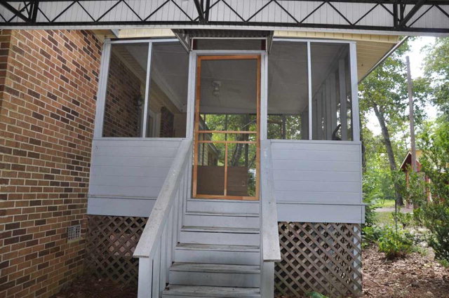 202 Delone Road Byron, GA 31008 - Photo 3 of 20 a view of house with wooden door and outdoor seating