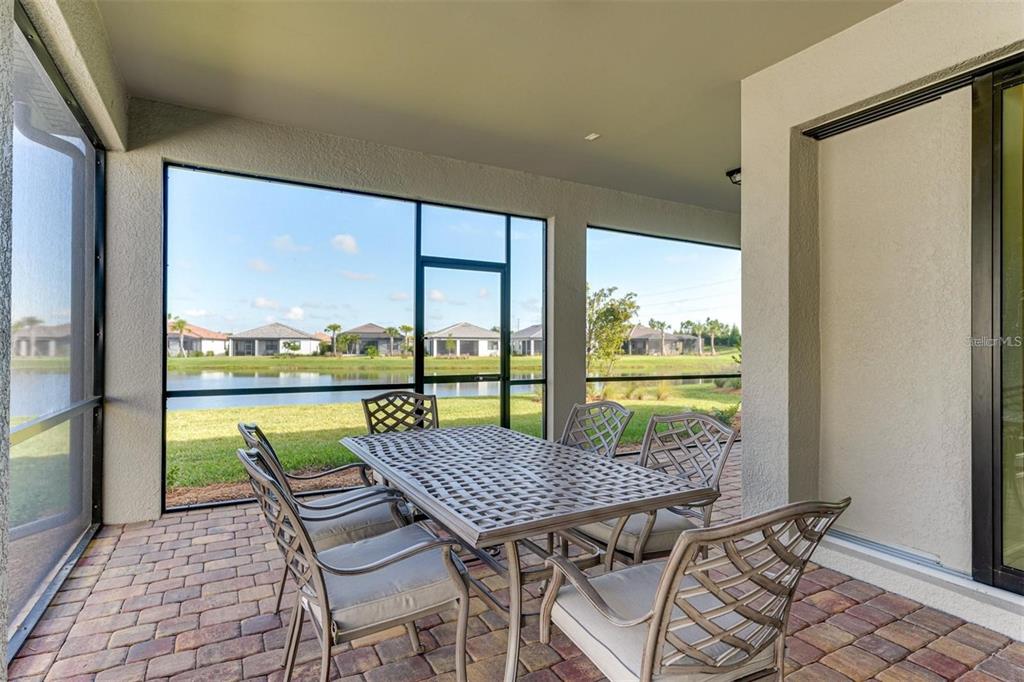 18023 Waterville Place Lakewood Ranch, FL 34202 - Photo 11 of 41 a view of a patio with furniture and window