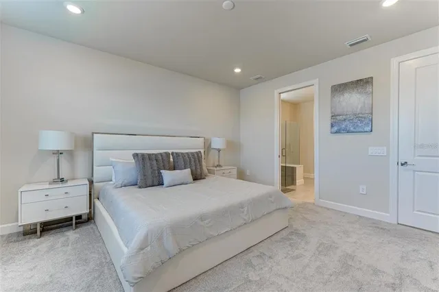 a bedroom with a bed and a dresser