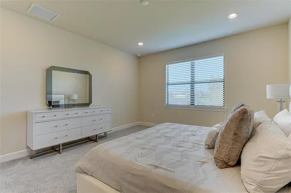 a bathroom with a double vanity sink and mirror