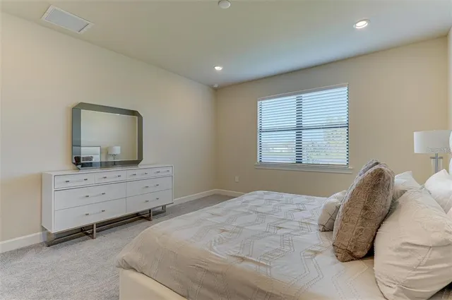 a bathroom with a double vanity sink and mirror