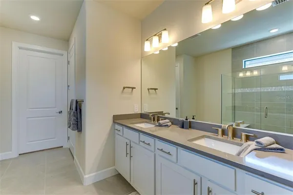 a bathroom with a shower and a sink