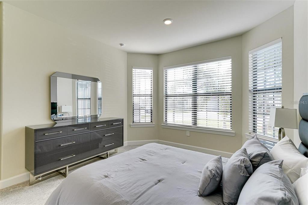 18023 Waterville Place Lakewood Ranch, FL 34202 - Photo 26 of 41 a bed room with a bed and a dresser