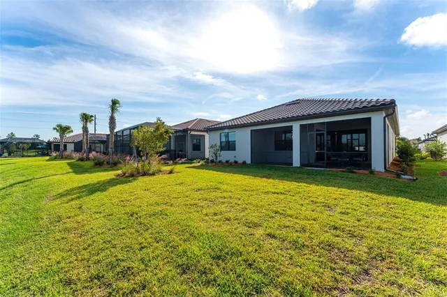 a view of a lake with houses in the back