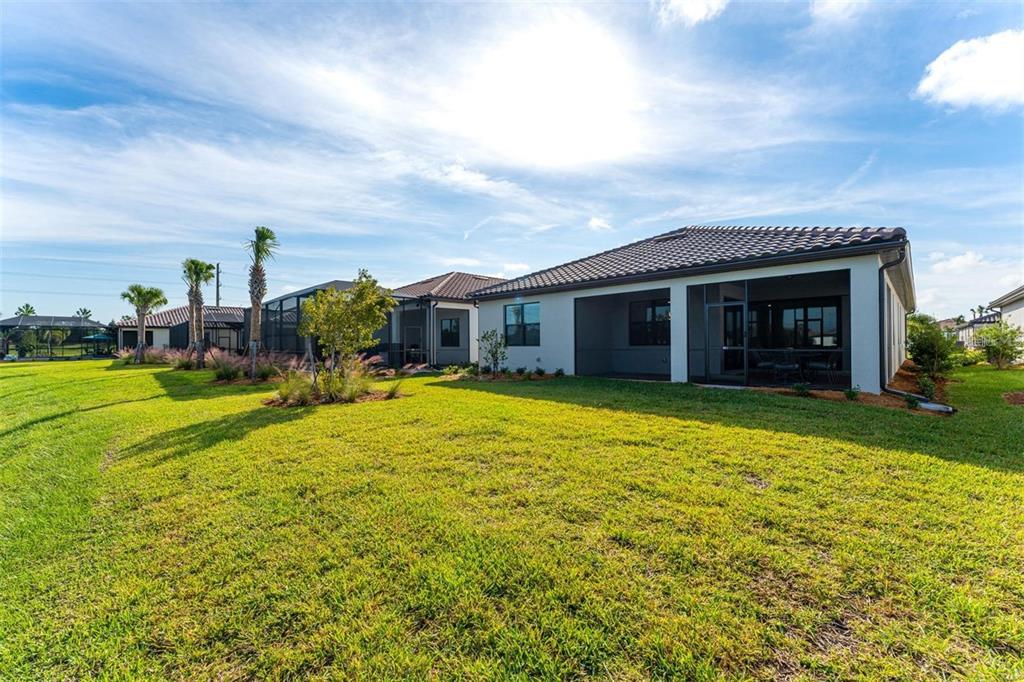 18023 Waterville Place Lakewood Ranch, FL 34202 - Photo 29 of 41 a front view of house with yard and entertaining space