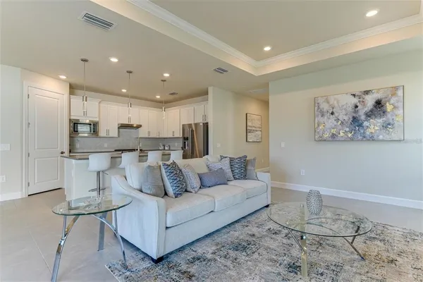 a living room with furniture and a painting