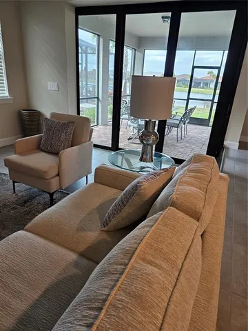 a view of a dining room with furniture window and outside view