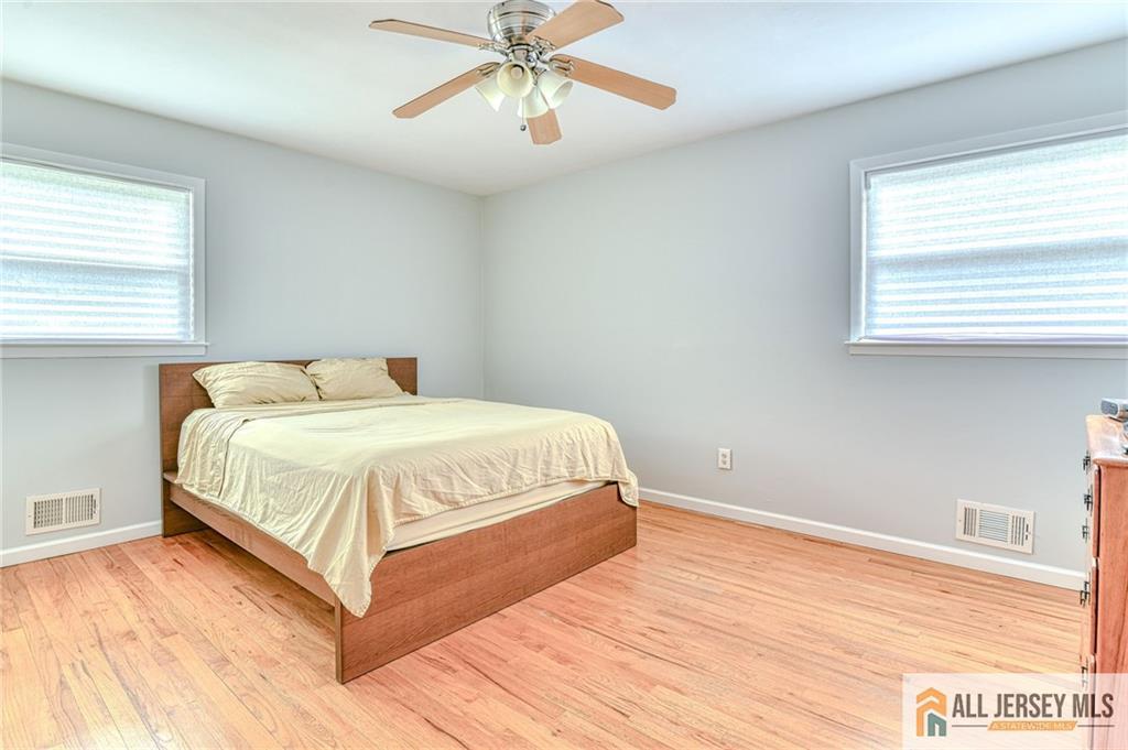 14 Gramercy Road Old Bridge, NJ 08857 - Photo 11 of 26 a bedroom with a bed and wooden floor
