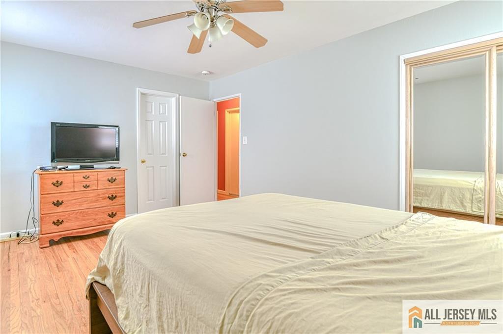 14 Gramercy Road Old Bridge, NJ 08857 - Photo 12 of 26 a bedroom with a bed and a flat screen tv