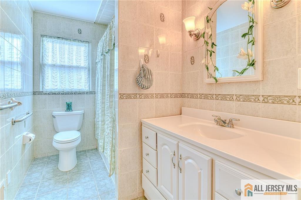 14 Gramercy Road Old Bridge, NJ 08857 - Photo 15 of 26 a bathroom with a sink and a toilet