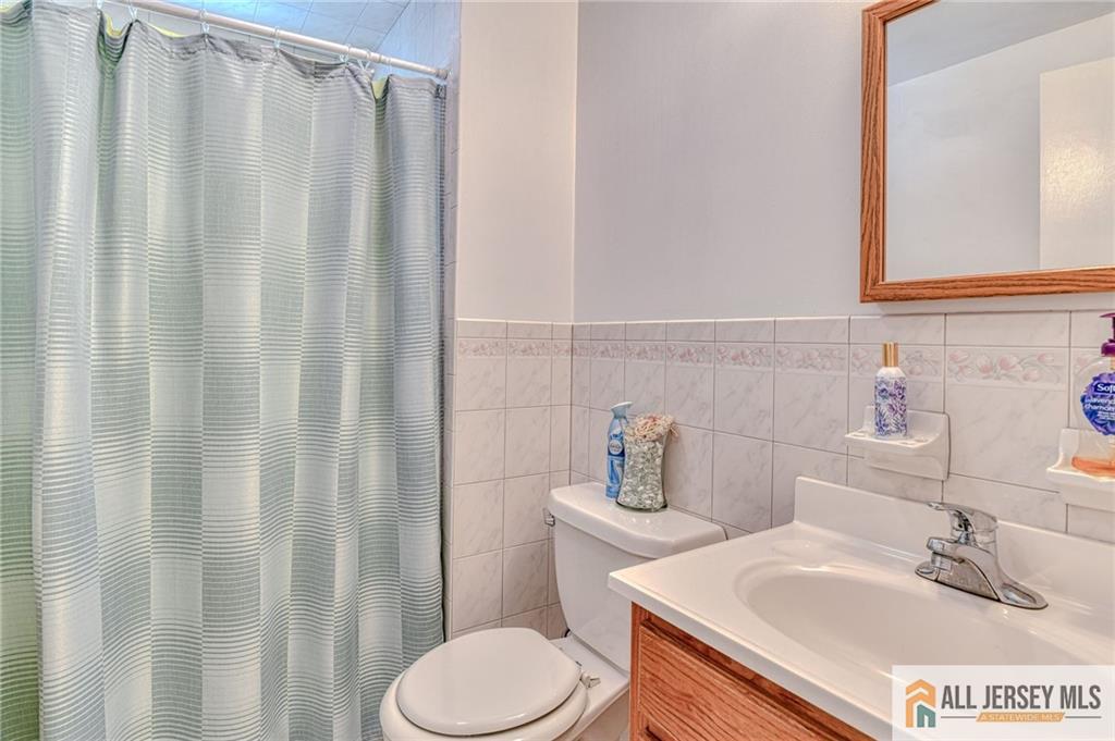 14 Gramercy Road Old Bridge, NJ 08857 - Photo 18 of 26 a bathroom with a sink and toilet