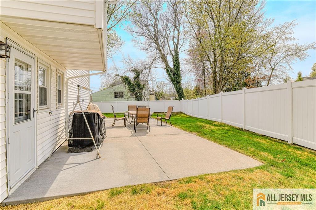 14 Gramercy Road Old Bridge, NJ 08857 - Photo 23 of 26 a view of a patio with a table and chairs