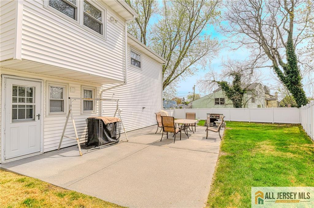 14 Gramercy Road Old Bridge, NJ 08857 - Photo 24 of 26 a view of a patio with table and chairs and potted plants