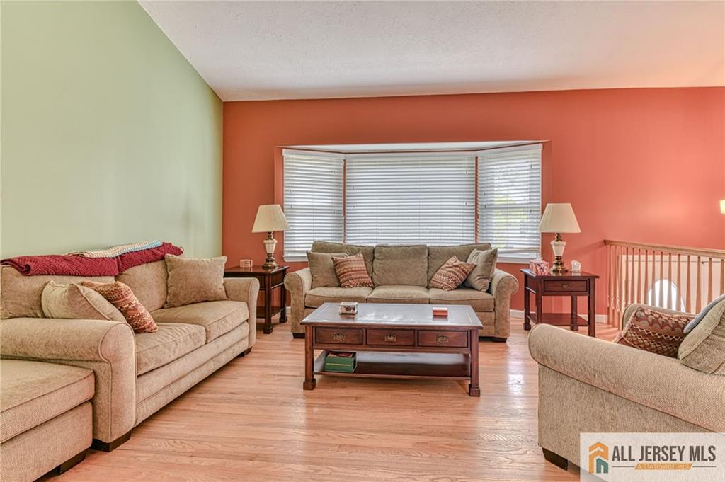 14 Gramercy Road Old Bridge, NJ 08857 - Photo 4 of 26 a living room with furniture and a wooden floor