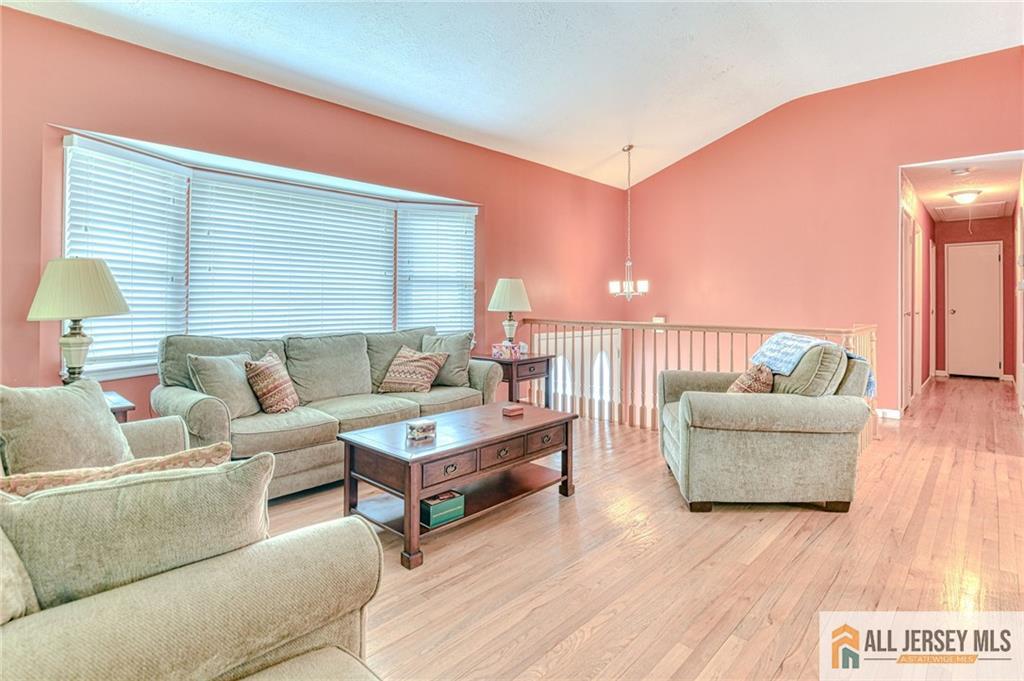 14 Gramercy Road Old Bridge, NJ 08857 - Photo 5 of 26 a living room with furniture and a wooden floor