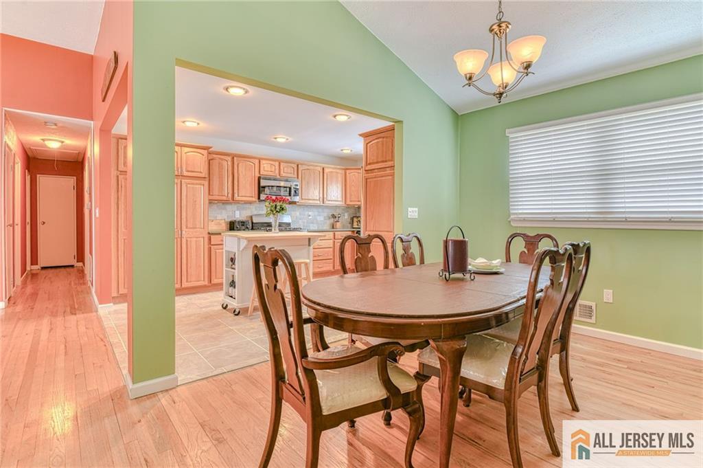 14 Gramercy Road Old Bridge, NJ 08857 - Photo 7 of 26 a view of a dining room with furniture and wooden floor