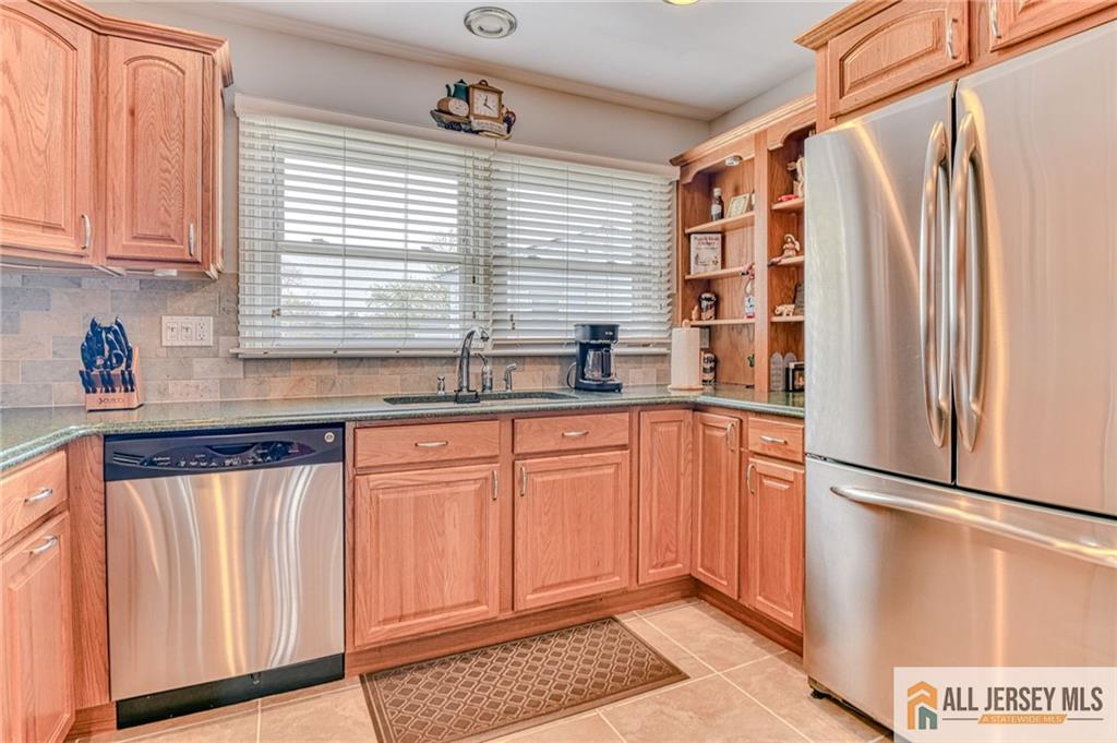 14 Gramercy Road Old Bridge, NJ 08857 - Photo 10 of 26 a kitchen with stainless steel appliances granite countertop a refrigerator and a sink