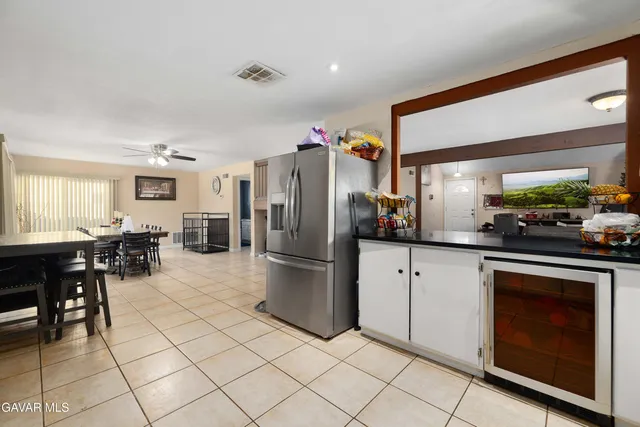 a kitchen with cabinets and stainless steel appliances