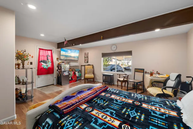 a living room with lots of furniture and a table