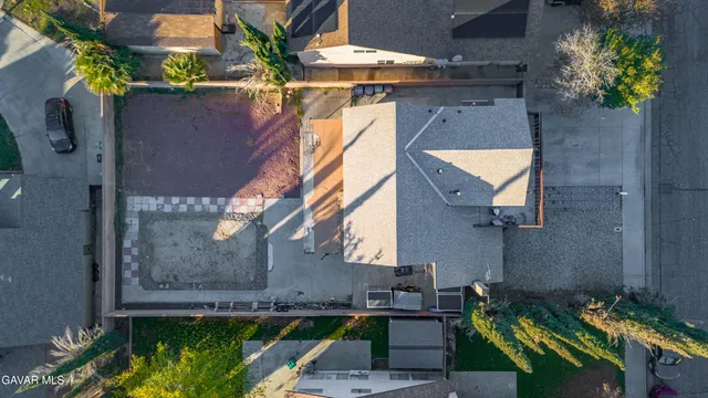 a view of a house with a tub and a yard with a fountain