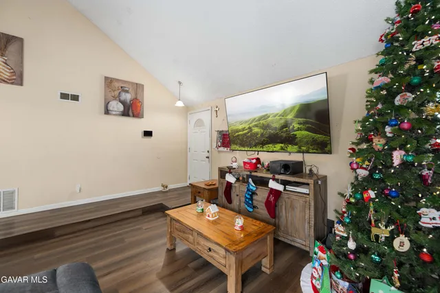 a room with furniture and a potted plant