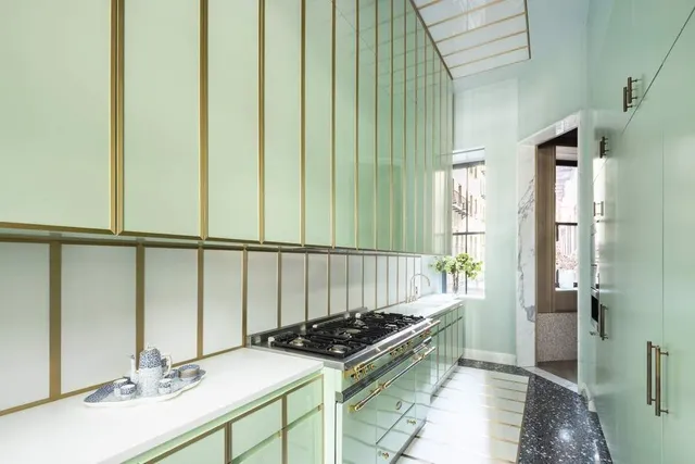 a kitchen with a sink and a stove top oven