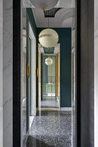 a view of a hallway with a chandelier