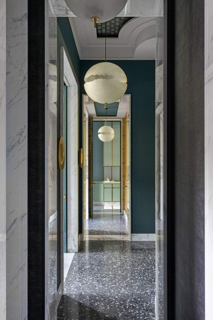 50 Central Park West, Unit MAIS-DUPLEX Manhattan, NY 10023 - Photo 16 of 36 a view of a hallway with a chandelier