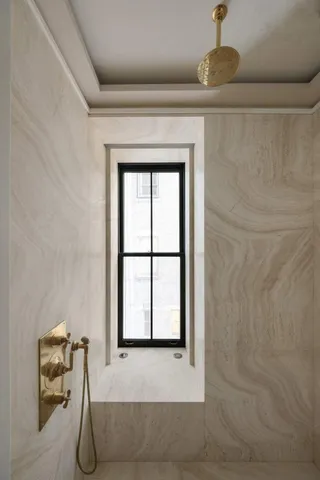 a bathroom with a toilet sink and shower