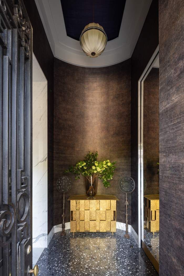 50 Central Park West, Unit MAIS-DUPLEX Manhattan, NY 10023 - Photo 35 of 36 a vase of flowers sitting on a floor in front of a door