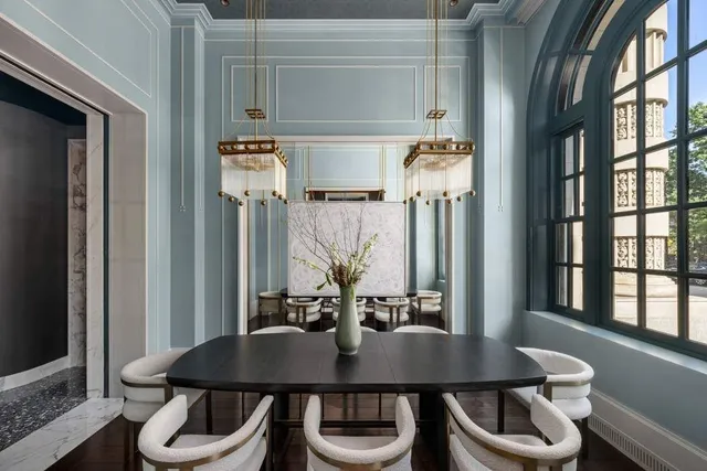 a view of a dining room with furniture and window