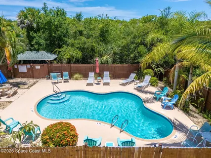 a view of a swimming pool with a patio
