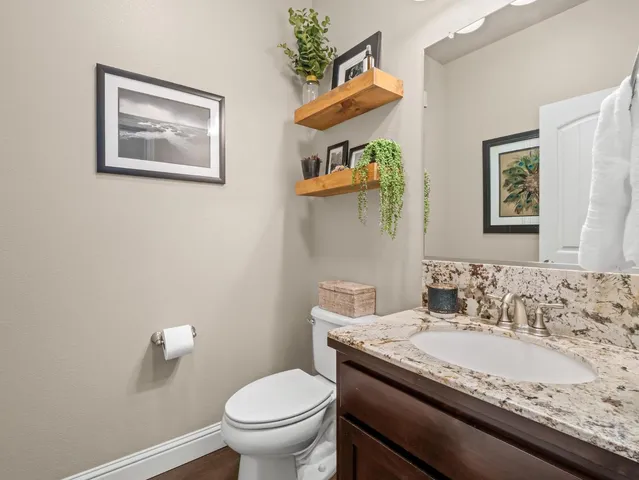 a view of hallway with wooden floor