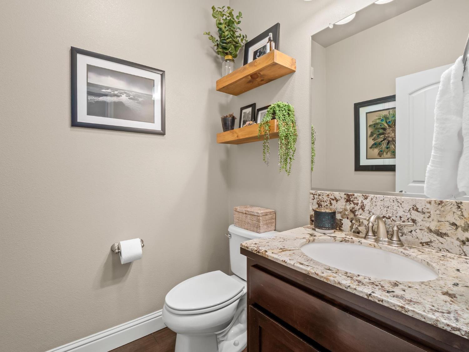 2750 Muncie Avenue Clovis, CA 93619 - Photo 14 of 51 a bathroom with a granite countertop sink and a toilet