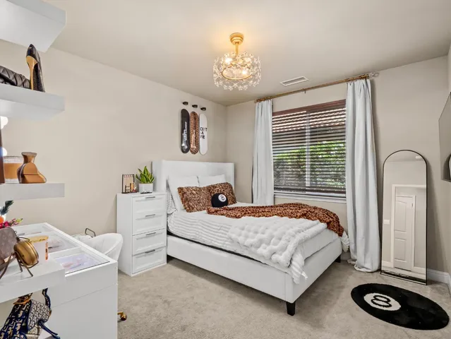 a bedroom with a bed and cabinets