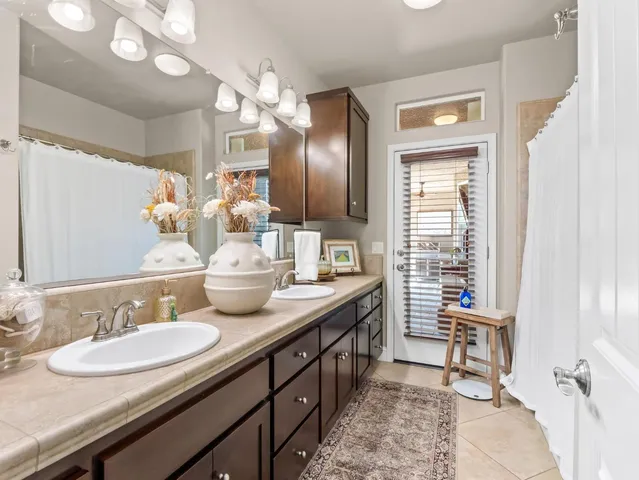 a bedroom with a bed and a table with chair