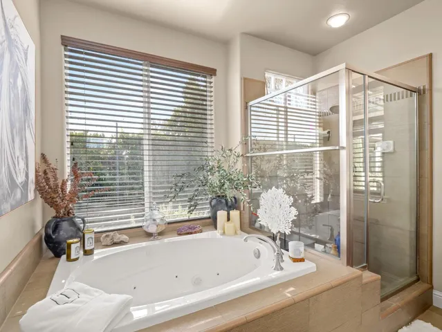 a bath tub sitting next to a window