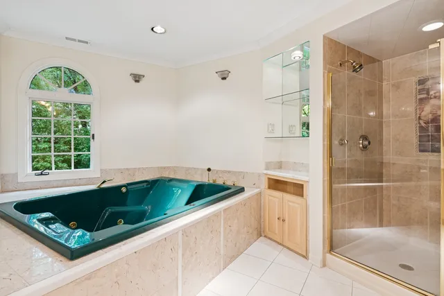 a view of house with a backyard